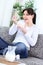 Happy young woman eating cornflakes