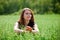 Happy young woman in a field.