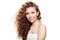 Happy young woman with healthy skin and perfect wavy hair