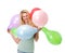 Happy young woman holding balloons