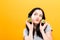 Happy young woman holding kiwis