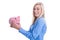 Happy young woman isolated with a pink piggy bank.