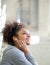 Happy young woman listening to music with earphones