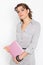 Happy young woman with pink netbook