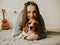 Happy young woman playing with her dog on a white background. Beagle dog with owner. Girl and dog at home