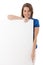 Happy young woman posing with blank sheet