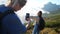 happy young woman is posing on mount slope for mobile photo, travelling at summer