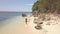 Happy young woman running on sea at sandy beach on tropical island at sunny day. Aerial view cheerful woman running on