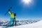 Happy young woman skier enjoying sunny weather in Alps