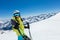 Happy young woman skier enjoying sunny weather in Alps