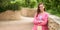 Happy young woman wearing fashionable bright clothes outdoor