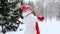 Happy young woman in winter forest