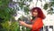 Happy young womanwith with tree flowers streeming