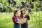 Happy young women gardener holding of ripe grape