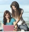 Happy young women with netbook