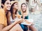 Happy young women tourists eating italian pizza enjoying summer vacation