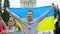 Happy youth raising Ukrainian flag, diaspora in Washington, patriotic nation