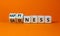 Happyness or sadness symbol. Turned cubes and changed the word `sadness` to `happyness`. Beautiful orange background. Business