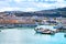 The harbor of Ancona with the boats docked and city panorama