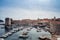 Harbor with boats in front of the city walls of Dubrovnik