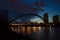 Harbor bridge, river, water reflection and evening sky Toronto, Canada