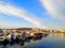 The harbor in Cannakale, Turkey-March 31, 2018: Many small motorboat are neatly  moored in the small bay, which the opposite side