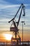 Harbor crane at sunrise