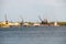 Harbor cranes at cargo port on the river Dnieper