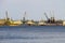 Harbor cranes at cargo port on the river Dnieper in Kremenchug