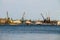 Harbor cranes at cargo port on the river Dnieper in Kremenchug