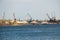 Harbor cranes at cargo port on river Dnieper in Kremenchug, Ukraine