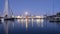 harbor docked sailboats cargo port cranes full Moon sky and water reflection horizon night lighting