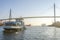 Harbor ferry and famous bridge KÃ¶hlbrandbrÃ¼cke during scenic afternoon light in Hamburg, Germany