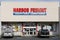 Harbor Freight building entrance with two cars parked outside