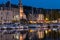 Harbor of historic Frenc city Honfleur with ships and restaurants