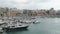 Harbor of Iraklion on Crete Greece. Ships and boats in the harbor right next to the historical town part of Iraklion with its fo