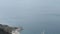 Harbor Ormos Athinios at Santorini Isle Greece. Aerial view over the Calders with its volcano isle Nea Kameni