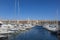 Harbor with sailing boats in Marseilles with view to the promenade of the old town