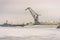 Harbor and ships in the winter with frozen water in Kronstadt