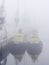 Harbor tug boats moored in a foggy dock