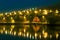 Harbor village houses and boats. Night with beautiful lights. Iceland.