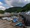 The harbor and village of Lynmouth in North Devon with many boats stuck at low tide