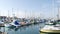Harbor village, yachts sailboats in marina. Nautical vessels in sea port. Oceanside, California USA.
