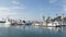 Harbor village, yachts sailboats in marina. Nautical vessels in sea port. Oceanside, California USA.