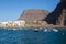 The Harbor of Vueltas in Valle Gran Rey with boats, buildings and mountains