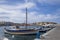 The harbor wharf in Hersonissos, Port with fishing boats and sailing boats.