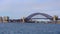 The harbour bridge view from western side while ferry boat passing, is an Australian heritage-listed steel through arch bridge.