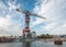 Harbour crane hotel with white clouds and blue sky