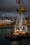 Harbour of Genoa Genova by night, Italy. View of the old port with a cloudy sky