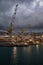 Harbour of Genoa Genova by night, Italy. View of the old port with a cloudy sky